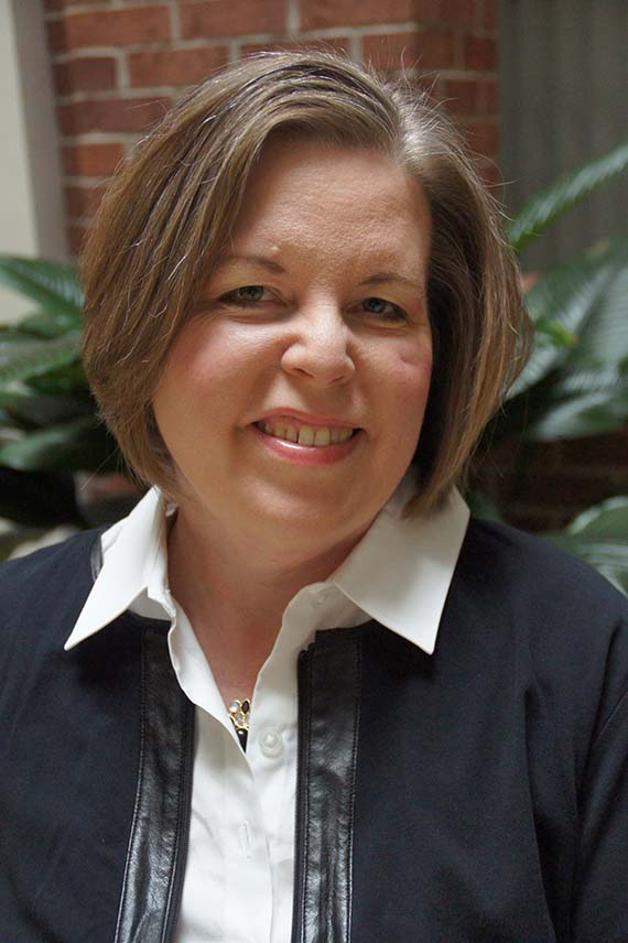 A smiling portrait of Michelle, a volunteer