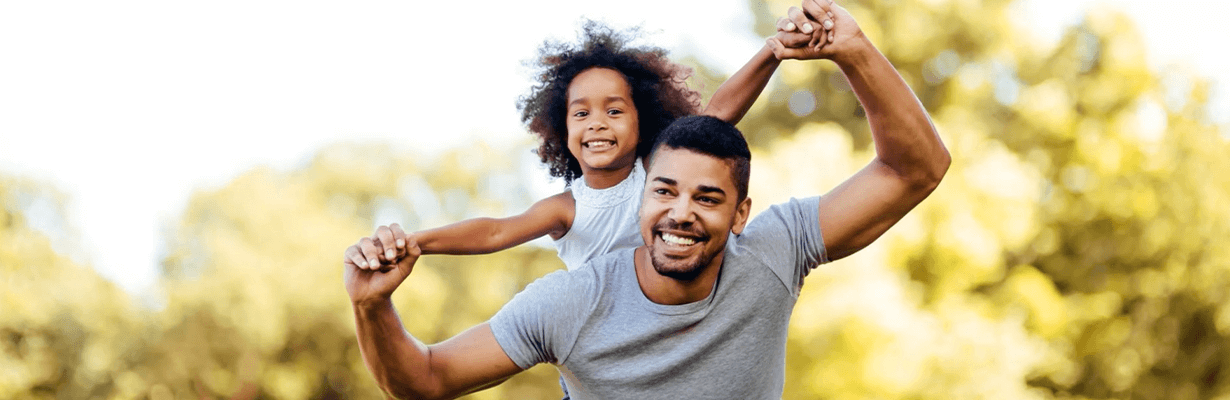 A daughter on her father's back