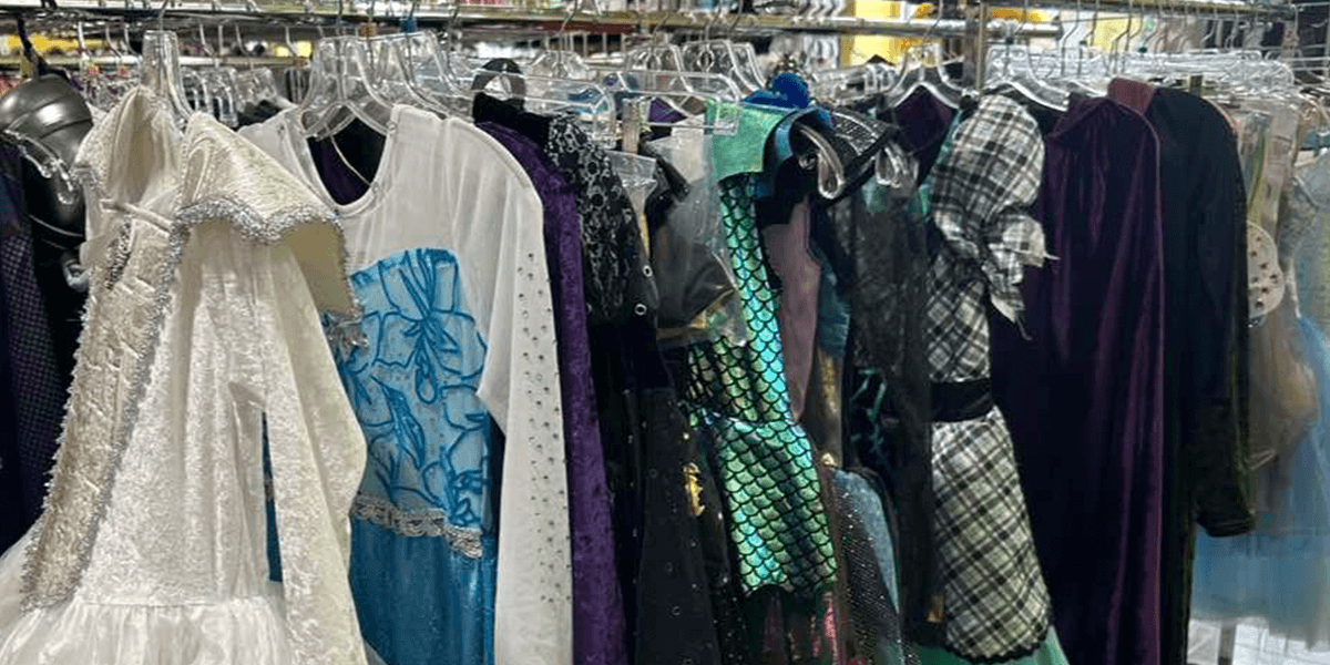 Halloween costumes on a clothing rack